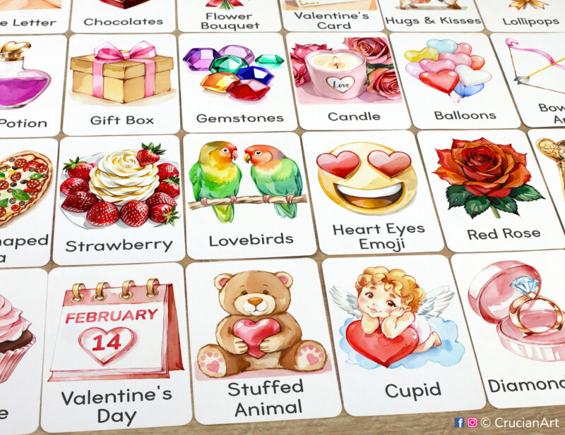 Set of Saint Valentine Day flashcards laid out on the table for learning activity: Cupid, February 14th Date, Teddy Bear Stuffed Animal, Red Rose, Lovebirds, Strawberry, Diamond Ring