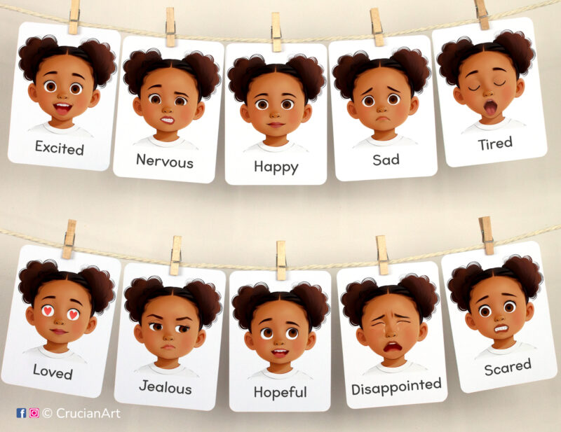 Set of Emotions and Feelings flashcards used as class or homeschool wall decor. Flash cards hang on twine with small wooden clothespins. Visual cards version for African American girls with black skin and hair.