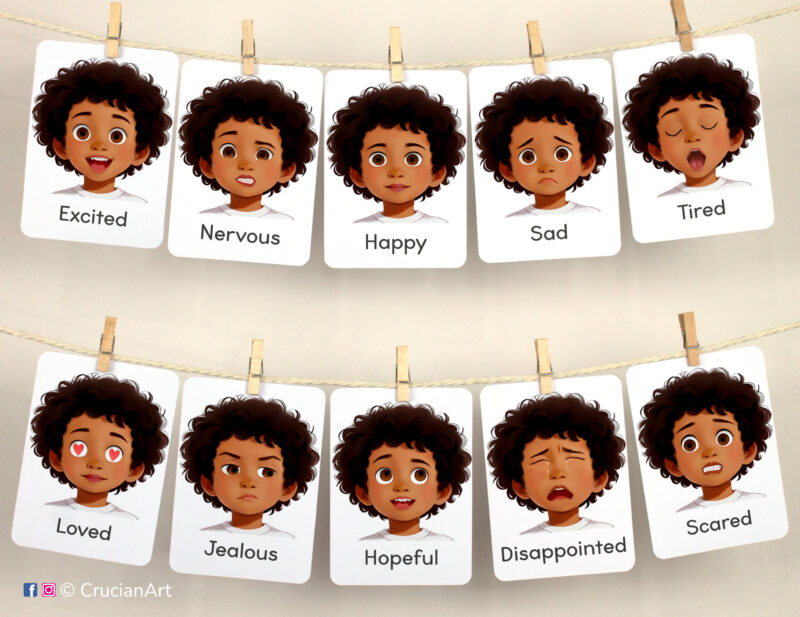 Set of Emotions and Feelings flashcards used as class or homeschool wall decor. Flash cards hang on twine with small wooden clothespins. Visual cards version for African American boys with black skin and hair.