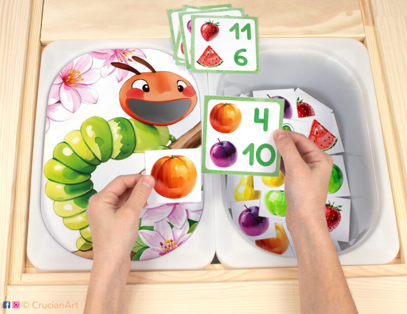 Hungry Caterpillar Flisat insert resource in a Montessori preschool. Spring early math counting activity placed on an IKEA Children's Sensory Table.