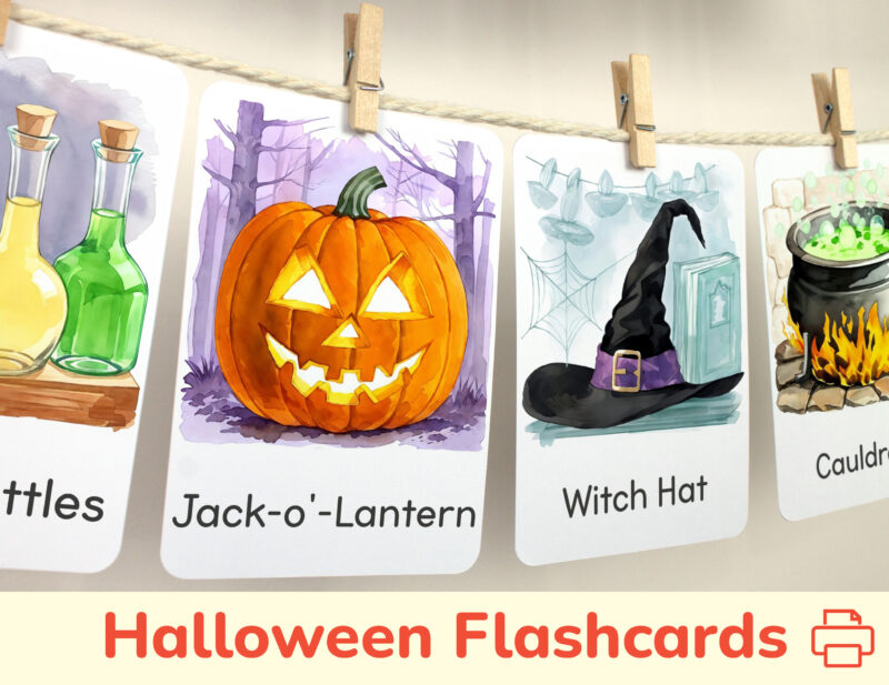 Jack-o-Lantern and Witch Hat watercolor flashcards hanging on twine with small wooden clothespins. Halloween Season curriculum classroom resources.