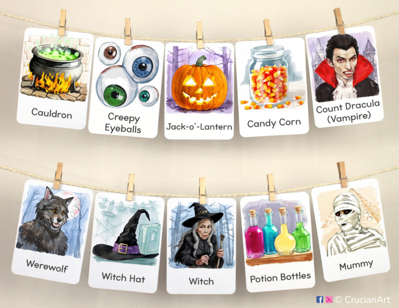 Set of Halloween Season watercolor flashcards used as class or homeschool wall decor. Seasonal visual flash cards hang on twine with small wooden clothespins.