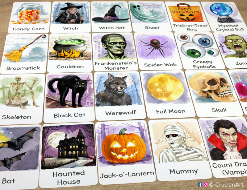 Set of Halloween Holiday flashcards laid out on the table for the fall season educational activity: Jack-o-Lantern, Mummy, Haunted House, Werewolf, Black Cat, Full Moon, Witch Cauldron, Spider Web
