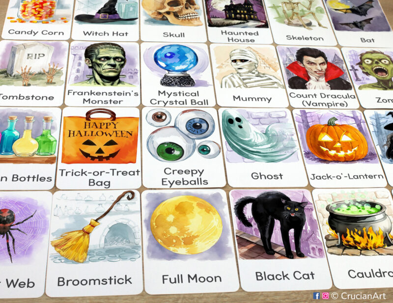 Set of Halloween Holiday flashcards laid out on the table for the autumn season educational activity: Black Cat, Full Moon, Broomstick, Jack-o-Lantern, Mummy, Haunted House, Werewolf, Witch Cauldron, Spider Web