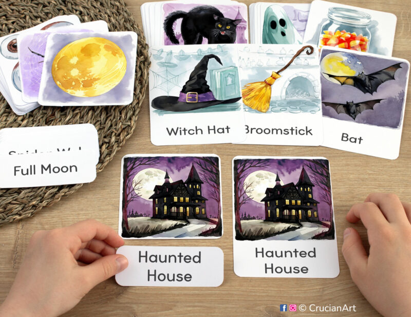 Three-part cards in practice: toddler pairing a word label with corresponding Haunted House image card. Halloween Holiday themed printable materials for the fall season week unit.