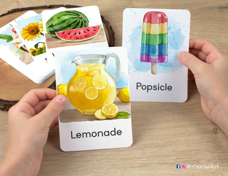 Lemonade and Popsicle watercolor flashcards in child's hands. Hot Season unit educational printables. Toddler, Preschool visual cards.