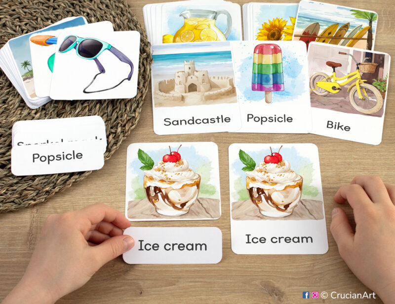 Summertime three part cards in use: preschooler matching a word label to an image card of Ice cream. Printables for Summer curriculum classroom resources.