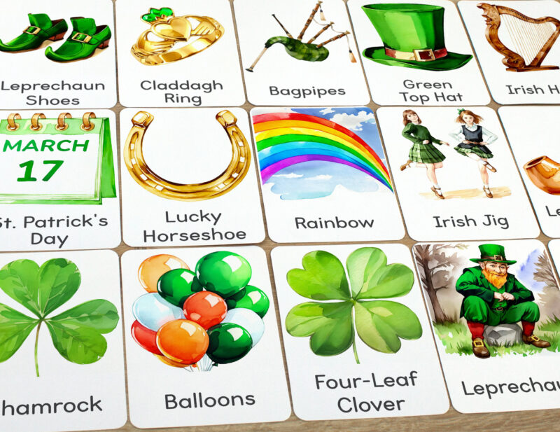 Set of Saint Patrick Day flashcards laid out on the table for learning activity: Rainbow, Four-Leaf Clover, Lucky Horseshoe, Leprechaun, Irish Jig, Claddagh Ring, and Balloons