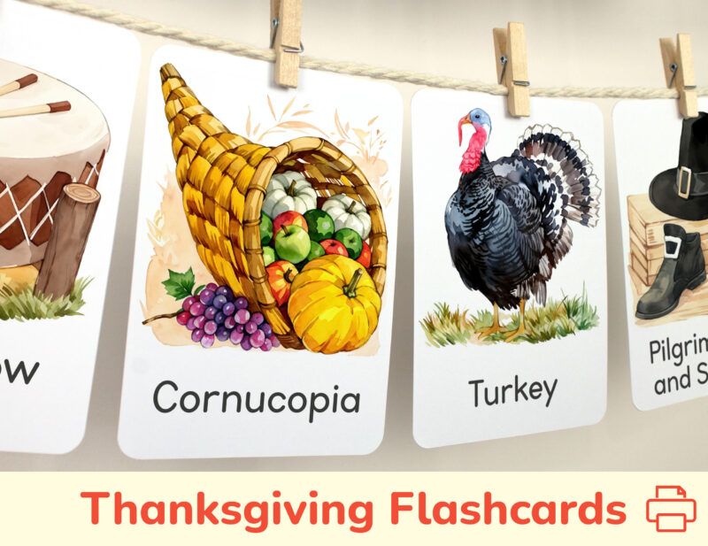 Cornucopia and Turkey watercolor flashcards hanging on twine with small wooden clothespins. Thanksgiving Day Holiday curriculum classroom resources.