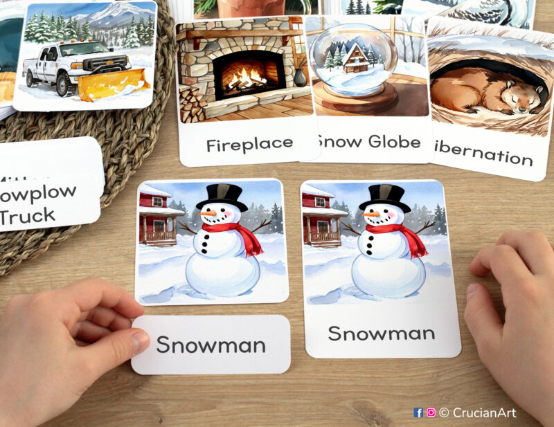 Three-part cards in practice: toddler pairing word label with corresponding Snowman image card. Winter Wonderland-themed printable materials for winter unit classroom activities.