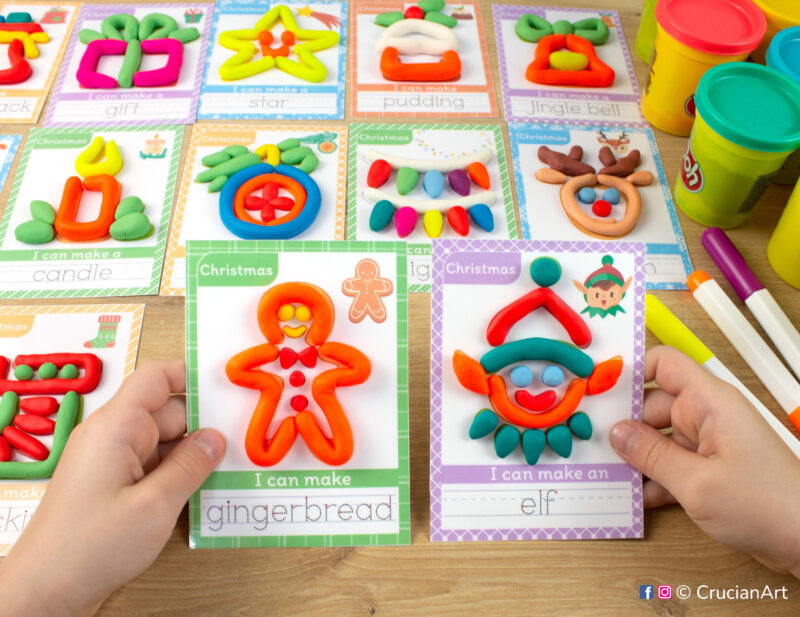 Christmas Holiday season hands-on playdough activities for preschool and toddler curriculum. Preschooler holds two play doh mats with images of a Gingerbread Man and Elf.