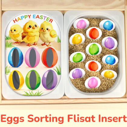 Easter chicks insert and colored Easter eggs placed on Trofast boxes in IKEA Flisat children's sensory table.
