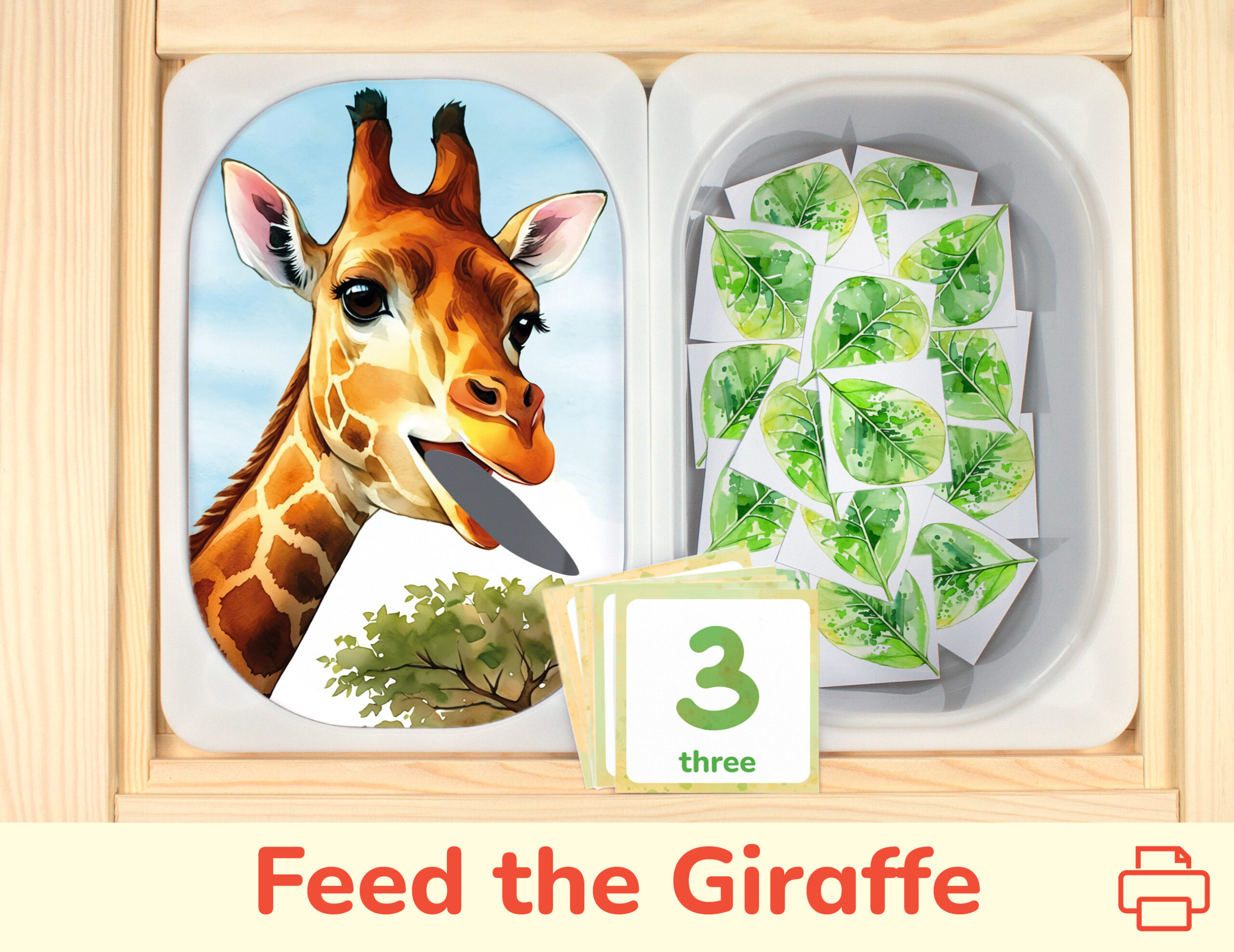 Feed the giraffe leaves counting activity placed on trofast boxes in ikea flisat children's sensory table. African safari and savannah theme toddler activity.