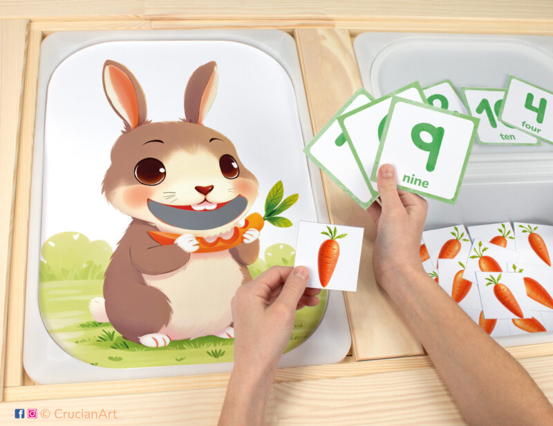 Feed the bunny carrots sensory bins play for toddlers: brown rabbit worksheet for an educational activity. DIY template inserted into IKEA Flisat table, with counters placed in the Trofast box.