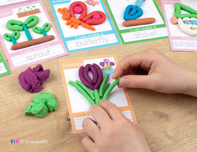 A preschooler is playing with play-doh, molding a crocus flower. Spring Garden season Montessori-inspired playdough mats for toddlers fine motor skill development.