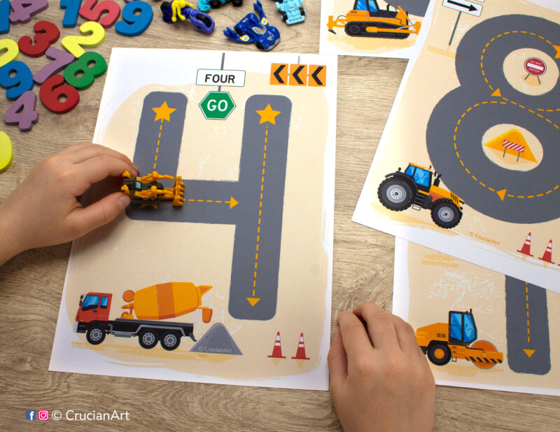 Preschooler playing with construction theme number mat. Printable educational resource for toddlers to learn how to write numbers.