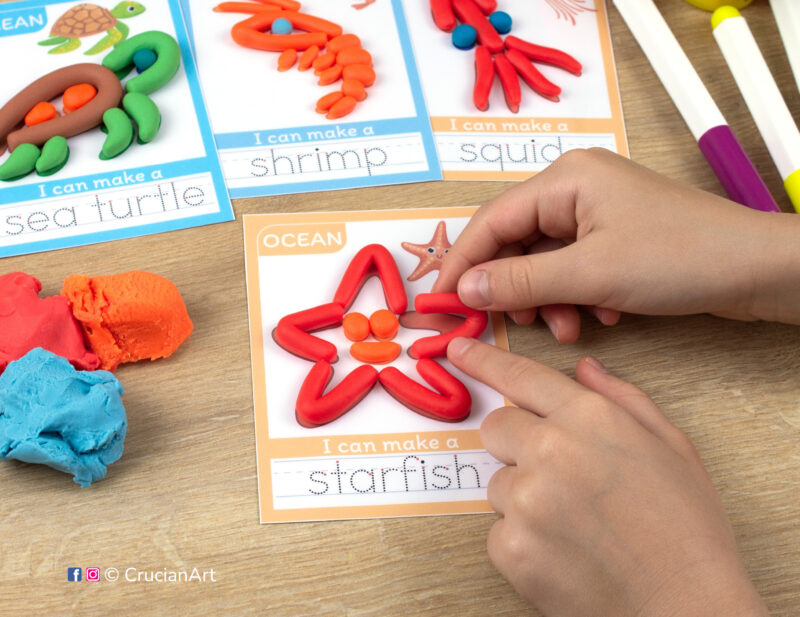 A preschooler is playing with play-doh, molding a starfish. Sea and ocean animals playdough mats for toddlers fine motor skill development.
