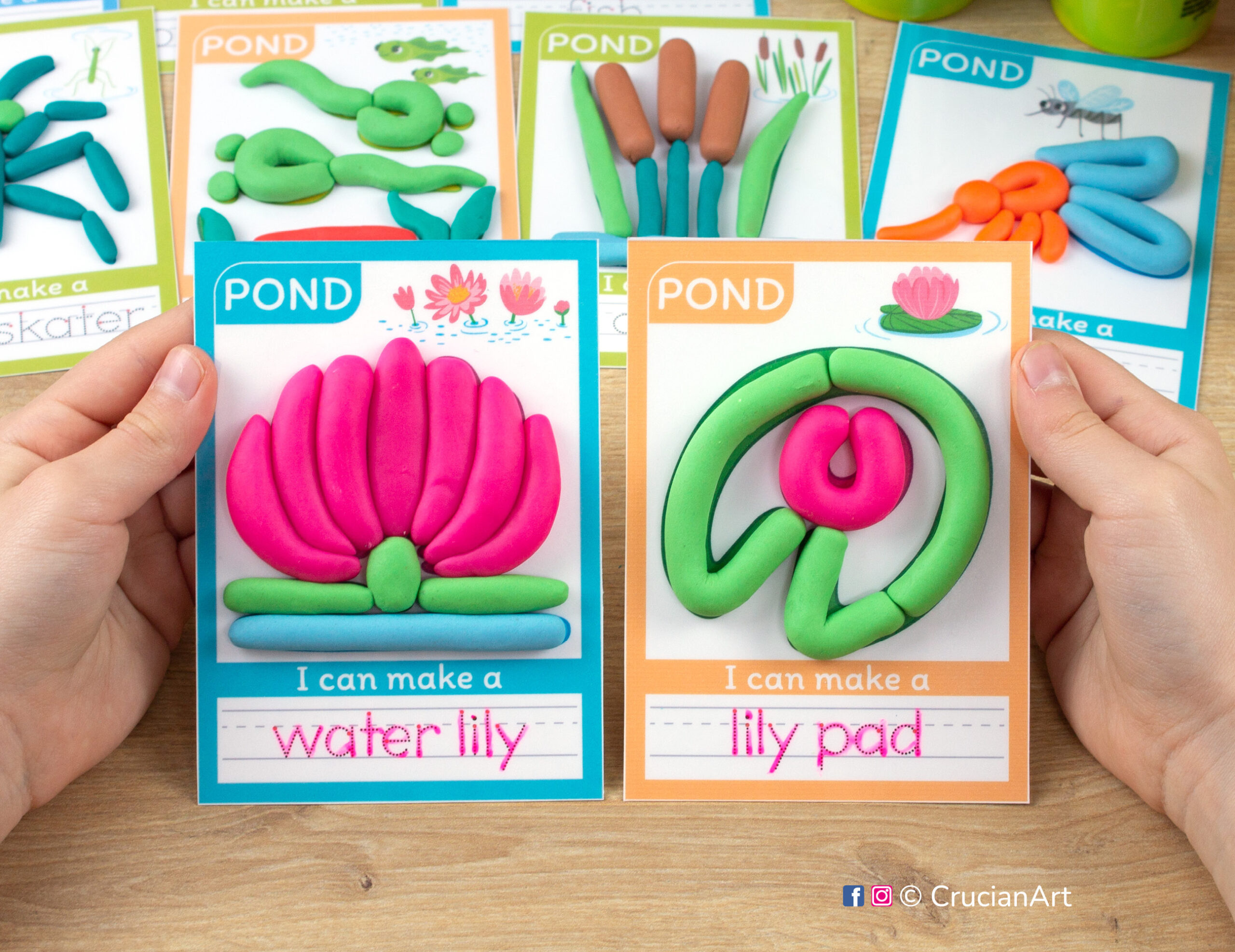 Pond Habitat hands-on play-doh activities for preschool and toddler curriculum. Preschooler holds two playdough mats with images of a water lily and a lily pad.