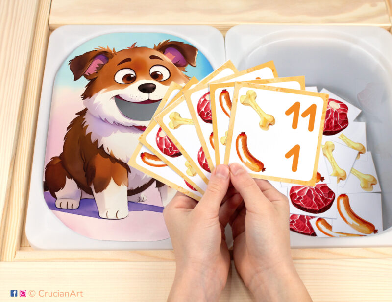 Feed the Hungry Pup pretend play setup for a matching and counting game. Kids' hands holding task cards displaying numerals and bones, steaks, and sausages. Pets unit printables for toddlers.