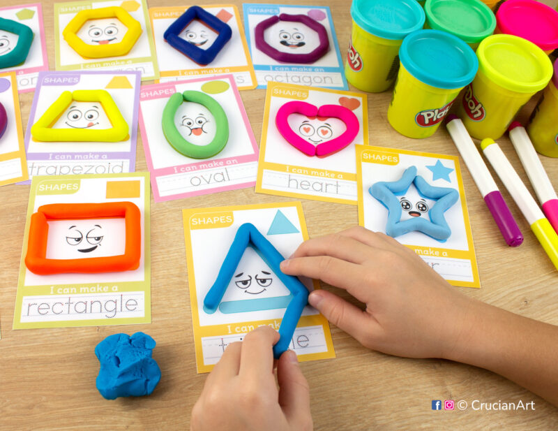 A preschooler is playing with play-doh, molding a blue triangle. Two-dimensional shapes playdough mats for toddlers fine motor skill development.