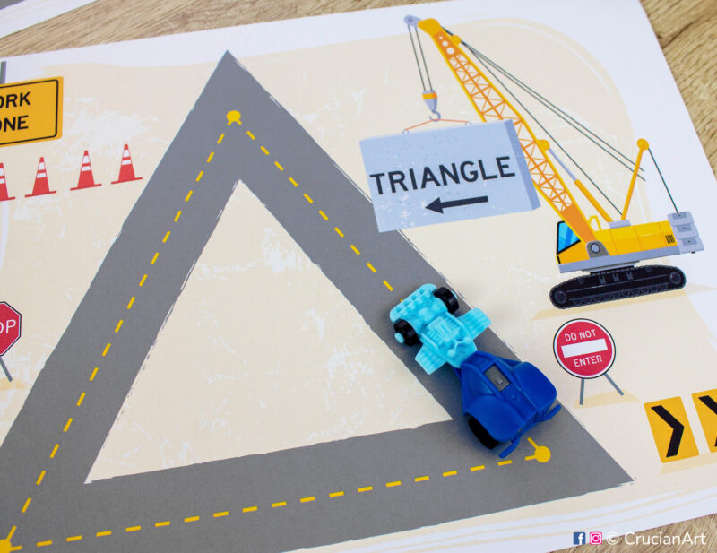 Printable construction site themed mat with a triangle shape.