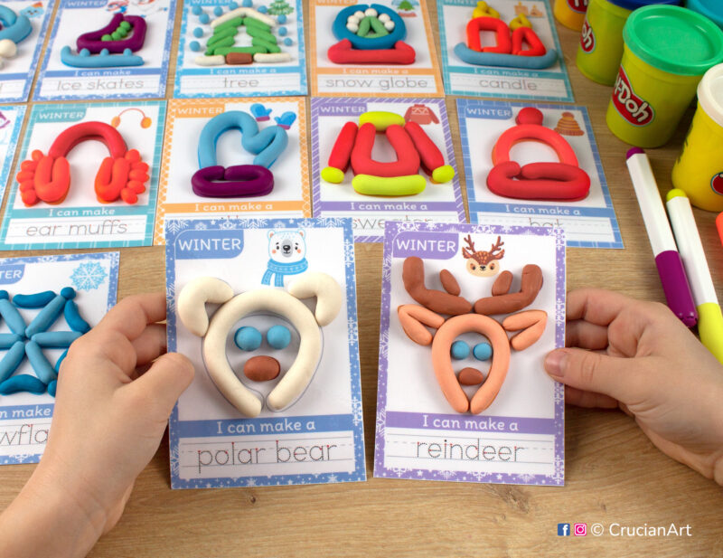 Winter season hands-on playdough activities for preschool and toddler curriculum. Preschooler holds two play doh mats with images of a Polar Bear and Rudolph Reindeer Caribou.