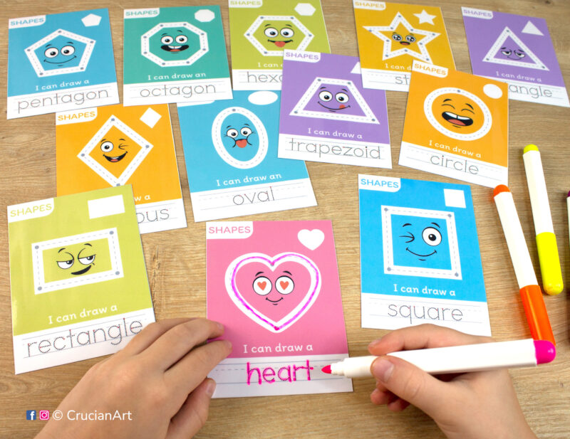 A toddler tracing a heart shape and shape name with a dry erase marker. Early math printable materials for 2d shape recognition. Easy to prepare preschool educational resource to learn about flat shapes: square, rectangle, oval, circle, trapezoid, pentagon, octagon, rhombus.