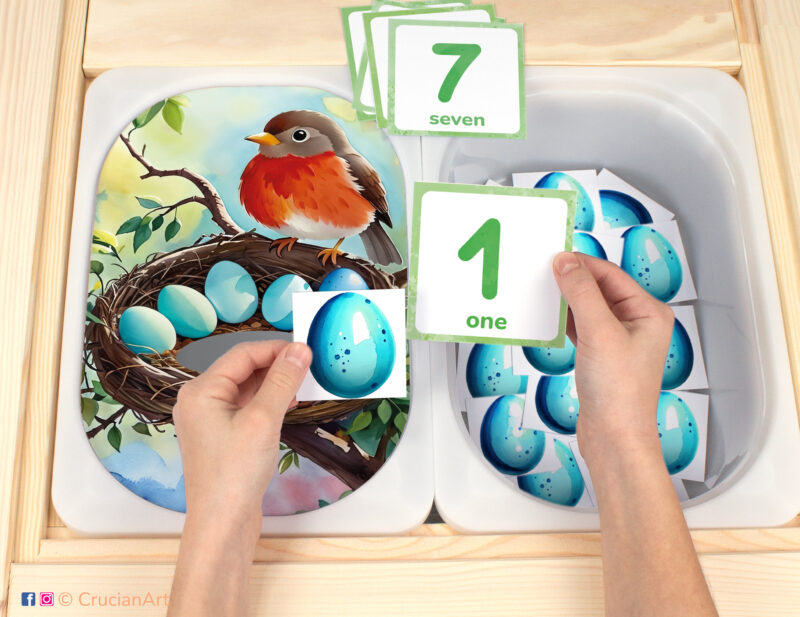 Eggs in Robin nest flisat insert resource in a Montessori preschool: early math counting activity placed on an ikea children's sensory table. Spring season play for kids sensory table insert.