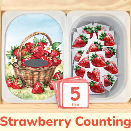 Strawberry counting activity placed on Trofast boxes in IKEA Flisat children's sensory table