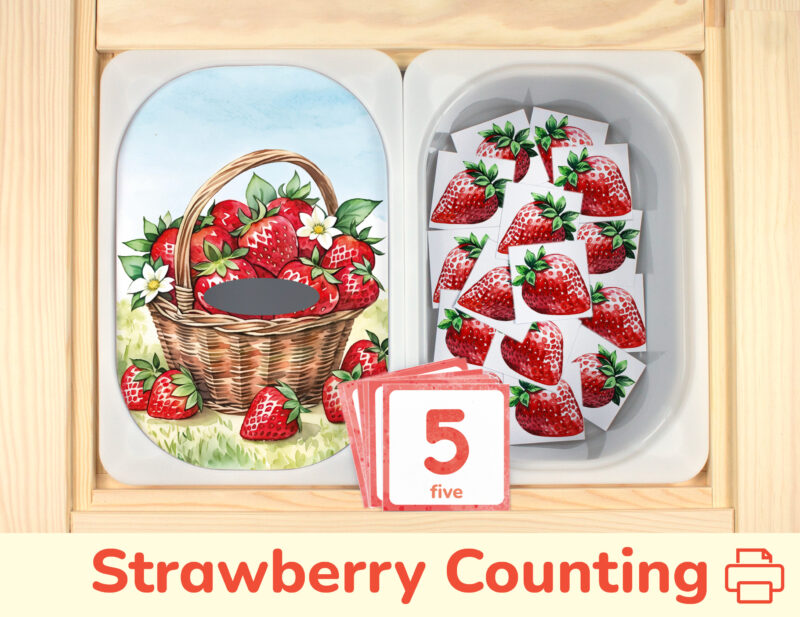 Strawberry counting activity placed on Trofast boxes in IKEA Flisat children's sensory table