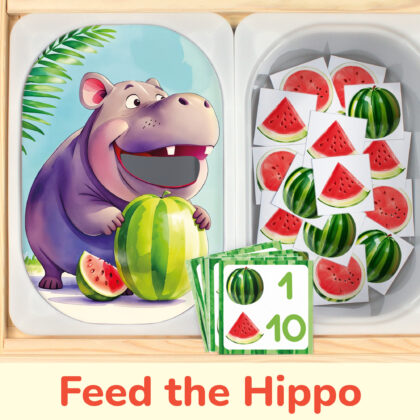 Feed the hippo watermelon sorting and counting activity placed on trofast boxes in ikea flisat children's sensory table. Printable toddler activity for zoo animals study unit.