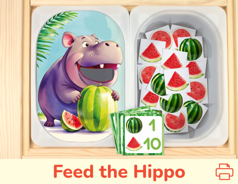 Feed the hippo watermelon sorting and counting activity placed on trofast boxes in ikea flisat children's sensory table. Printable toddler activity for zoo animals study unit.
