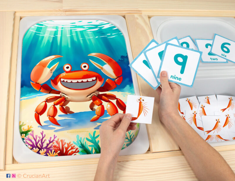 Feed the crab plankton sensory bins play for toddlers: ocean animals theme worksheet for an educational activity. DIY template inserted into ikea flisat table, with counters placed in the trofast bin.