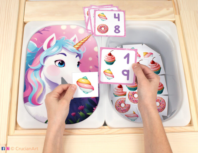 Let's feed the rainbow unicorn with cupcakes, marshmallows, and donuts Flisat insert resource in a Montessori preschool. Sweets and treats theme early math counting activity placed on an IKEA children's sensory table.