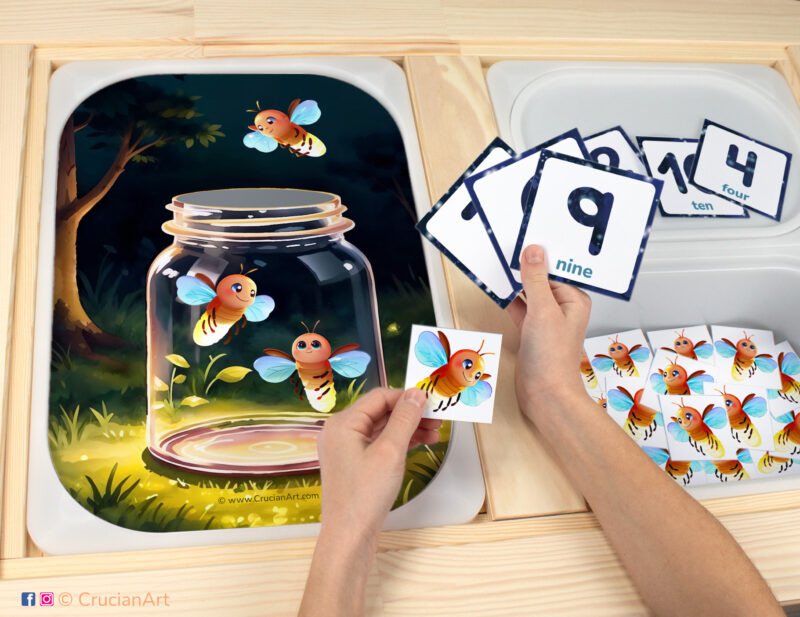 Catching fireflies sensory bins play for toddlers: summer insects theme worksheet for an educational activity. DIY template inserted into ikea flisat table, with counters placed in the trofast bin.