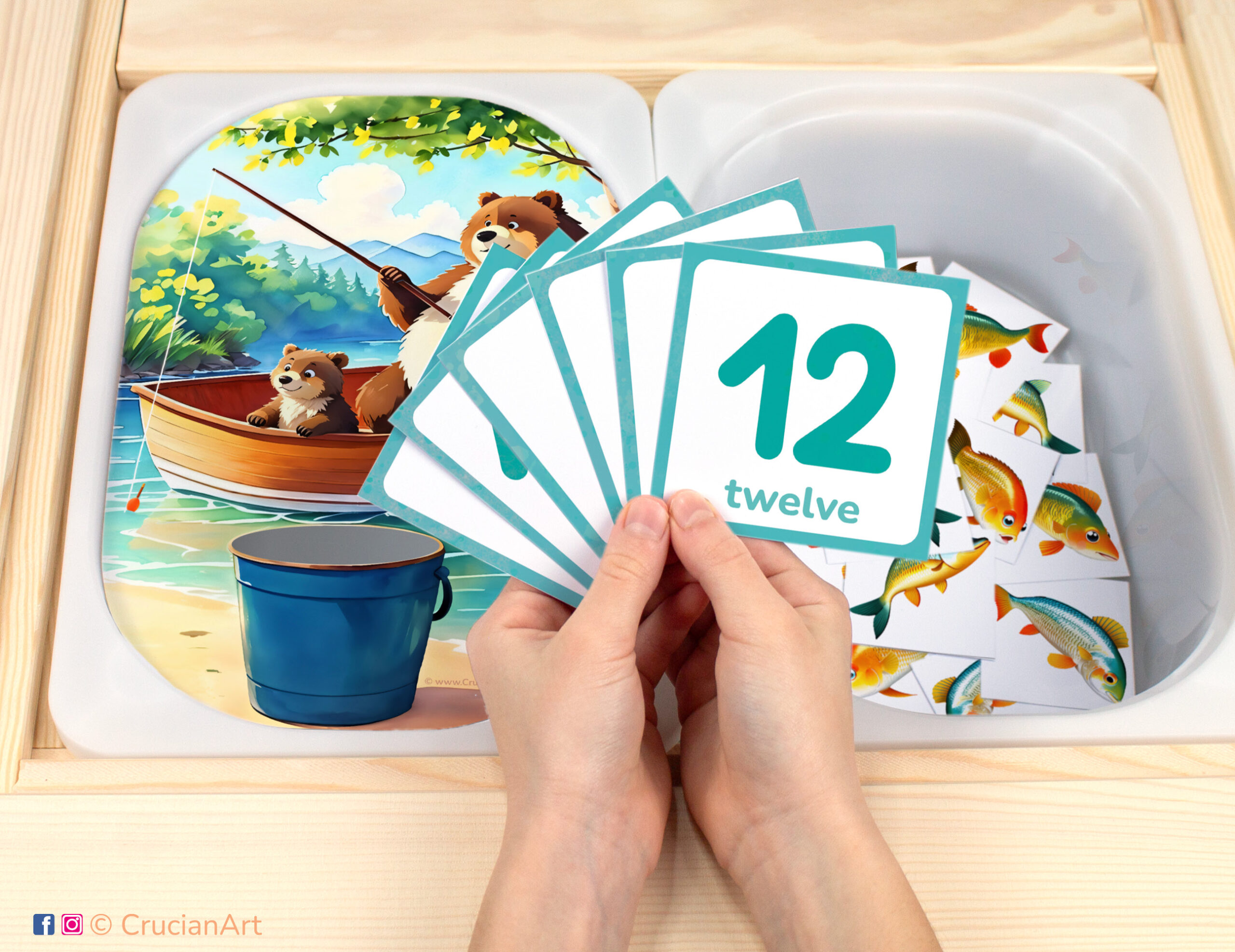 Fishing with bears pretend play setup. Sensory table insert and kids hands holding task cards displaying numerals from 1 to 12. Printable activity for summer camp unit.