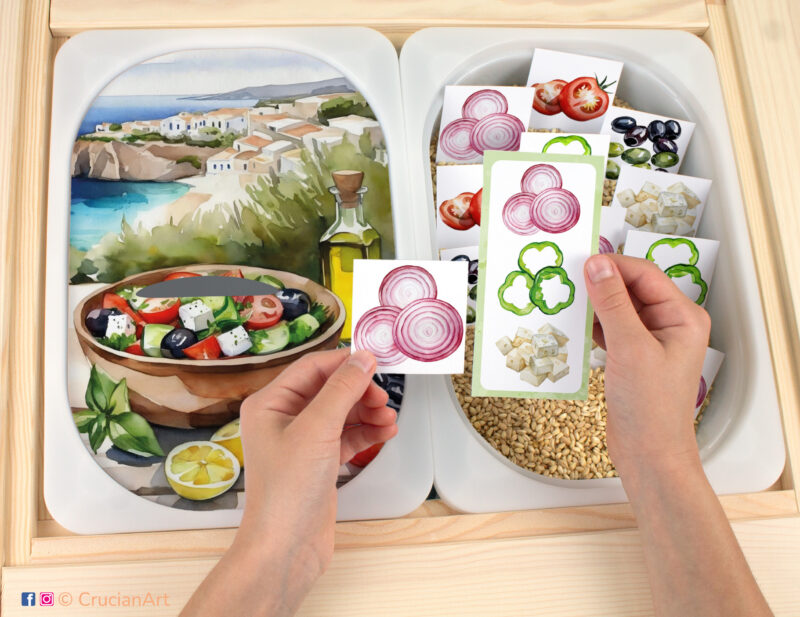 Let's make Greek salad with tomatoes, cucumbers, green bell pepper, olives, red onion, and feta cheese Flisat insert printable resource. Preschool matching activity template on an IKEA children's sensory table.