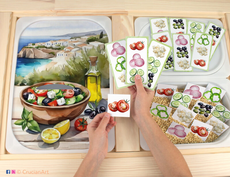 Making Greek Salad activity for toddler matching play. Printable educational template for flisat sensory table. Pieces with tomatoes, cucumbers, green bell pepper, olives, red onion, and feta cheese placed in the Trofast bin.