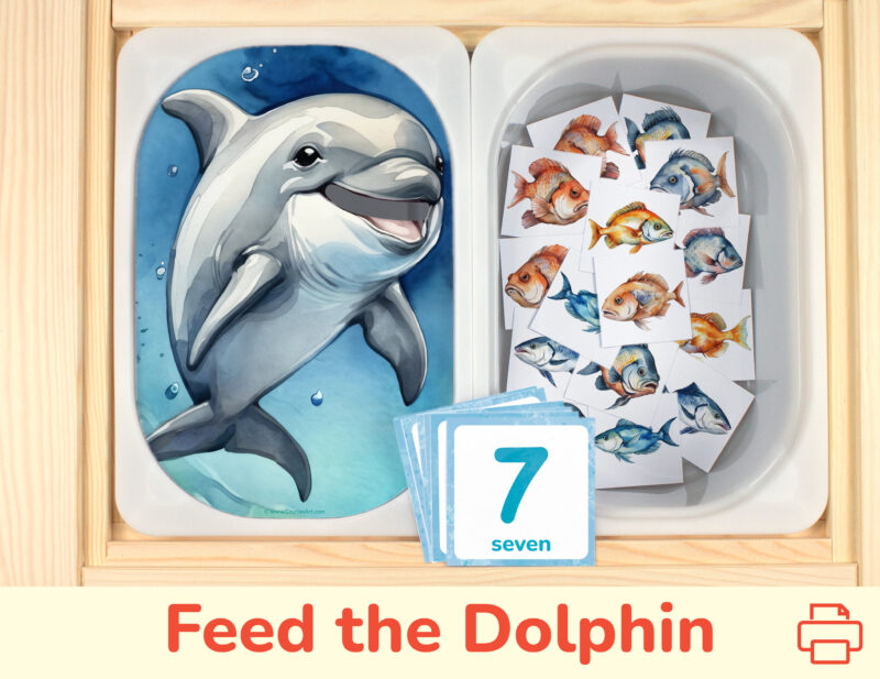 Feed the dolphin fish preschool counting activity placed on trofast boxes in ikea flisat children's sensory table. Printable toddler activity for ocean animals unit.