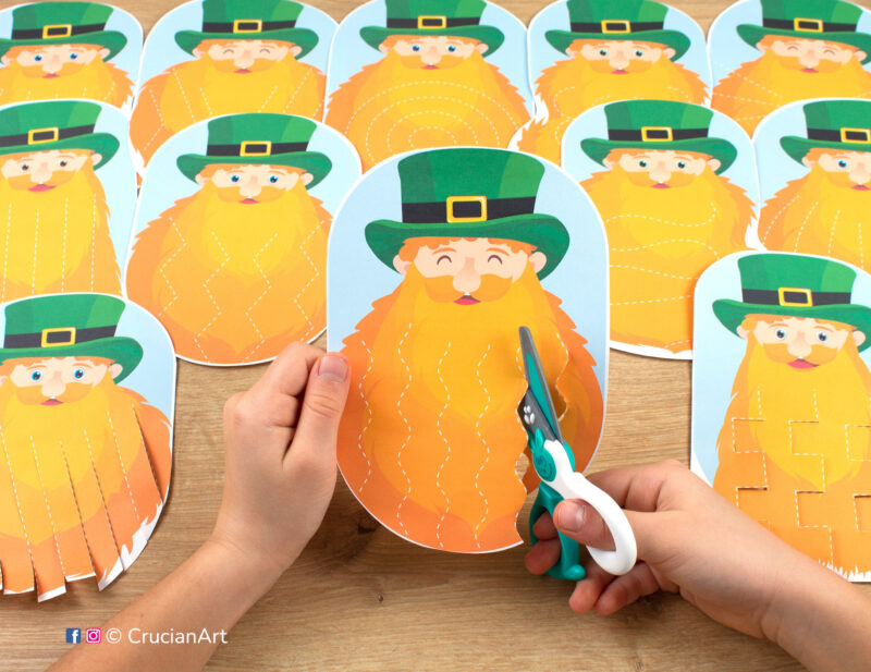 Preschooler cutting Saint Patrick’s beard during holiday season. Printables for little learners to develop their scissor skills.