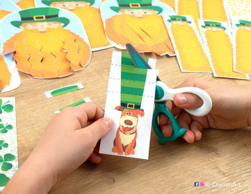 A child cutting Patrick’s Day-themed scissor strips. Printables for classroom or homeschool use.