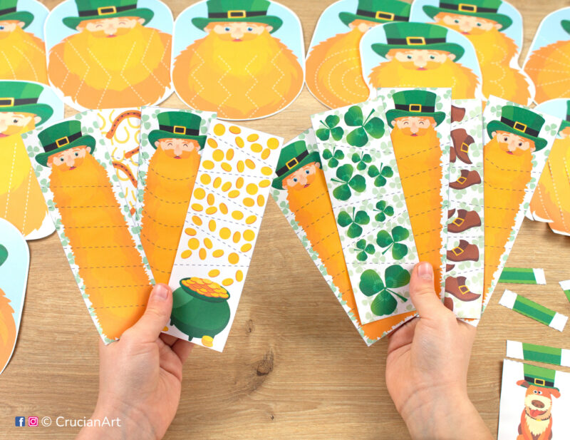 Little learner holding Patrick’s Day themed scissor strips with the dotted lines to practice straight, zigzag, and curved cutting patterns. Printable learning materials for toddlers and preschoolers.