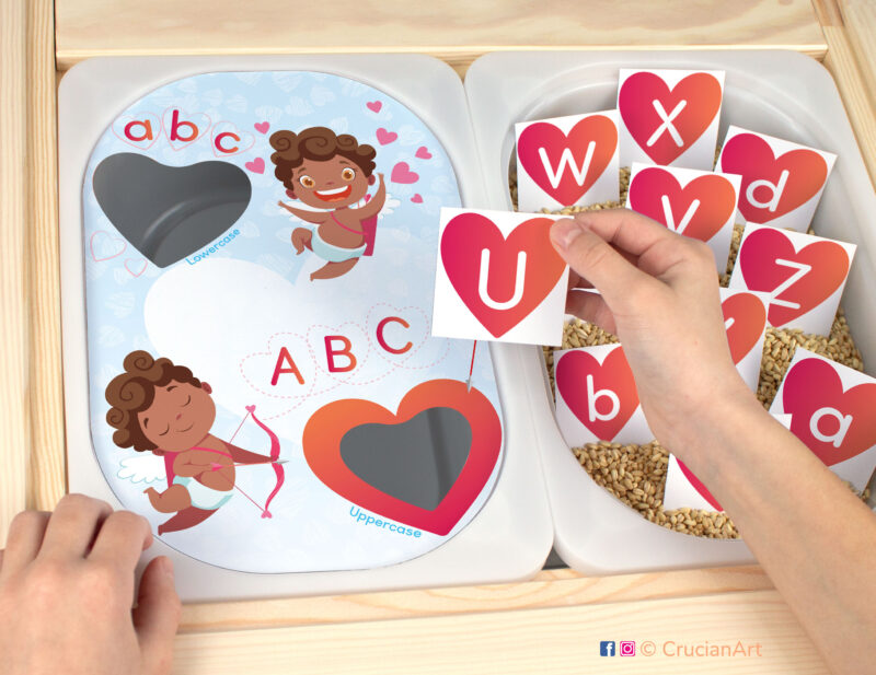 Saint Valentine day holiday activity for ikea flisat sensory table. Printable insert for trofast bins. DIY educational material for preschool and kindergarten classrooms. Upper and lowercase letters matching and sorting game. Brown skin Cupids holding bow and arrow and hearts.